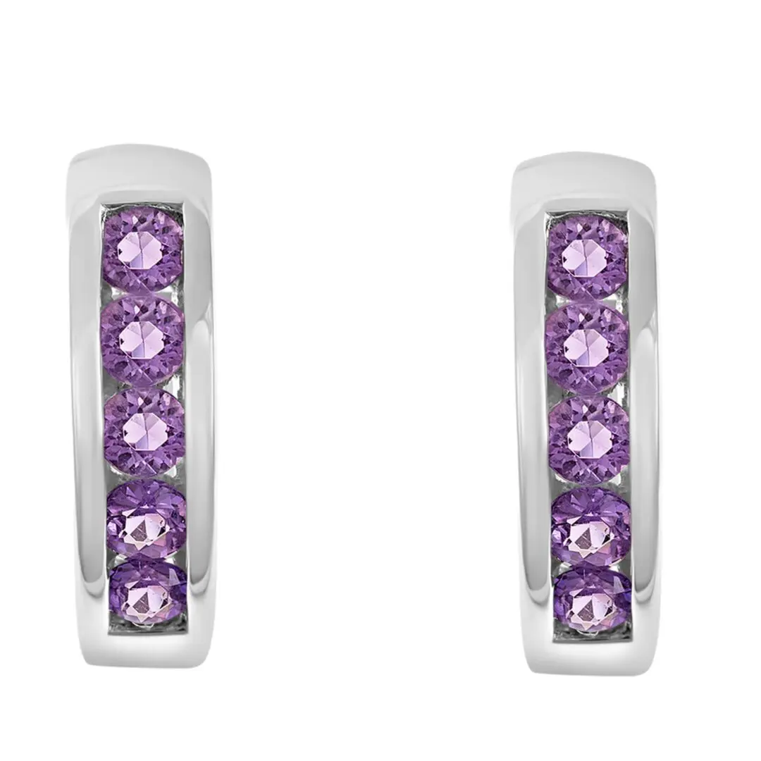 A pair of earrings with purple stones on them.